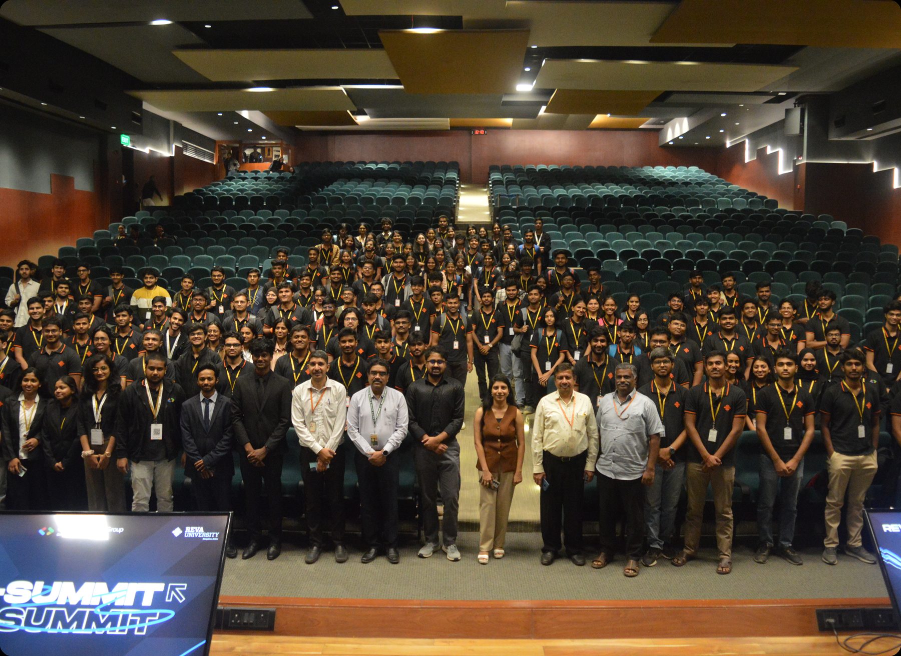 Group photograph with attendees at a summit.